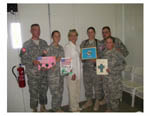 Mary presents prayer cards written by Oklahoma children to soldiers in Iraq