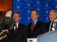 A bald eagle joins Mike's news conference as he introduces the Endangered Species Recovery Act