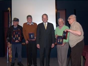 Rep. Israel presents WWII veterans with overdue service medals. 12/3/08