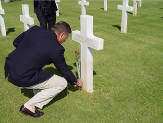 Senaor Burr at the grave of Private First Class William S. Snead of North Carolina, who served with the 1st Field Artillery Observation Battalion.  There are 187 North Carolinains buried at the North Africa American Cemetery.  PFC Snead was a recipient of the Purple Heart and was posthumously awarded the Silver Star.