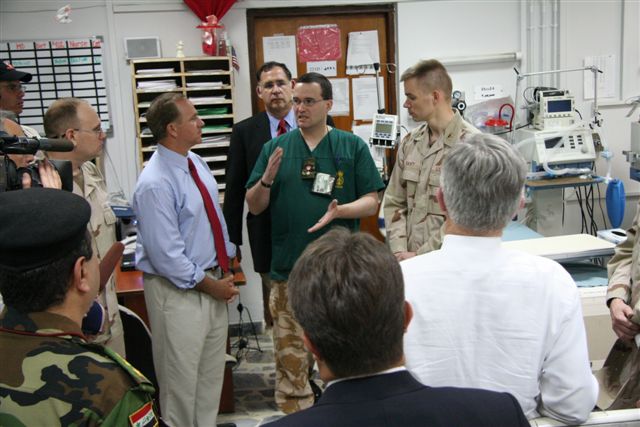 a British Army lieutenant colonel and surgeon briefs the congressional delegation on the surgical capabilities of the 10th Combat Surgical Hospital, in Baghdad on August 16.