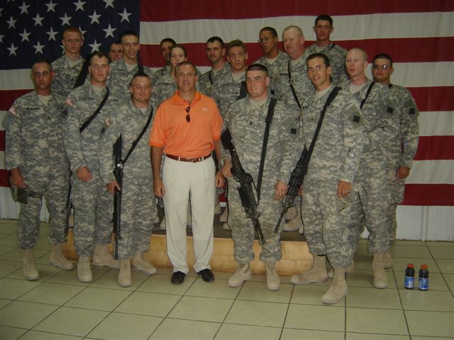 Flanked by Hoosiers at Camp Anaconda, Congressman Buyer stands proudly with members of the Army Reserve's 209th Quartermaster Company, headquartered in Lafayette, Indiana