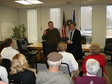 On Thursday, November 29th, Sen. Coleman completed his visits to every county during 2007 counties in the seat of Swift County with a reception at Benson City Hall.  Here, Coleman is introduced by Benson Mayor Paul Kittelson.     
