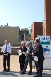 Senator Carper presents a USDA loan to the City of Milton