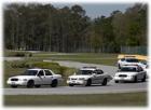 Law enforcement officials practice driving skills.