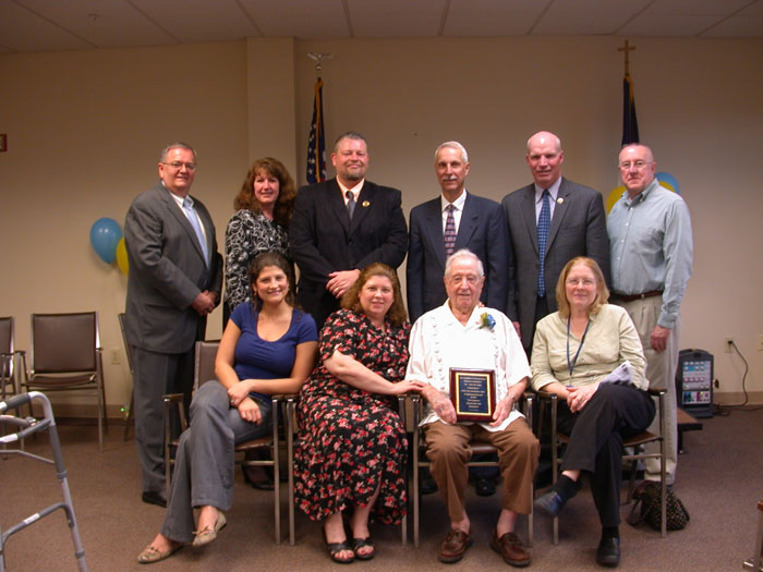 April 6, 2010: Congressman Holden was at Luther Ridge Personal Care Center, Pottsville, to congratulate John Boyd Hale for his 42 years of dedicated service to the Schuylkill Haven School District. Mr. Hale was first elected as a member of the Schuylkill Haven School Board in 1967. He served as board secretary since 1984. (In the photo, front from left - members of the Hale family - Rebekah Beck, granddaughter; Beth Felty, daughter; Mr. Hale; and Kathy Dautrich, daughter. In back from left, Richard Rada, Retired District Superintendent; Lorraine Felker, Current District Superintendent; Congressman Tim Holden; and Scott Jacoby, School Board President.)