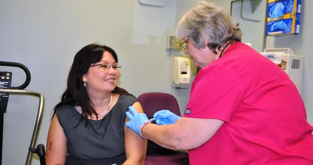 VA Assistant Secretary for Public and Intergovernmental Affairs Tammy Duckworth receives a flu shot