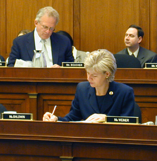 Photo: Tammy working on legislation in Committee.