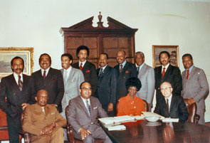 The 13 founding members of the newly formed CBC gathered for a picture. Standing left to right are: <a href="/member-profiles/profile.html?intID=60">Parren Mitchell</a> of Maryland, <a href="/member-profiles/profile.html?intID=110">Charles Rangel</a> of New York, <a href="/member-profiles/profile.html?intID=25">William L. (Bill) Clay, Sr.</a>, of Missouri, <a href="/member-profiles/profile.html?intID=38">Ronald V. Dellums</a> of California, <a href="/member-profiles/profile.html?intID=26">George Collins</a> of Illinois, <a href="/member-profiles/profile.html?intID=34">Louis Stokes</a> of Ohio, <a href="/member-profiles/profile.html?intID=62">Ralph Metcalfe</a> of Illinois, <a href="/member-profiles/profile.html?intID=89">John Conyers, Jr.</a>, of Michigan, and <a href="/member-profiles/profile.html?intID=78">Walter Fauntroy</a> of the District of Columbia. Seated left to right are: <a href="/member-profiles/profile.html?intID=32">Robert Nix, Sr.</a>, of Pennsylvania, <a href="/member-profiles/profile.html?intID=29">Charles Diggs, Jr.</a>, of Michigan, <a href="/member-profiles/profile.html?intID=24">Shirley Chisholm</a> of New York, and <a href="/member-profiles/profile.html?intID=30">Augustus (Gus) Hawkins</a> of California.