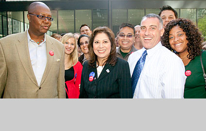 Secretary Hilda L. Solis and a group of people
