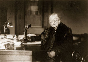 <a href="/member-profiles/profile.html?intID=74">Rebecca Latimer Felton</a> of Georgia, the first woman to serve in the U.S. Senate, poses at her desk in the Senate Office Building. Felton&rsquo;s appointment to an unexpired term in 1922 lasted a day.