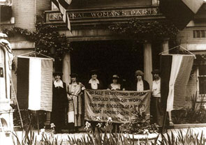 Alice Paul (second from left), chairwoman of the militant National Woman&rsquo;s Party, and officers of the group in front of their Washington headquarters, circa 1920s. They are holding a banner emblazoned with a quote from suffragist Susan B. Anthony: &quot;No self-respecting woman should wish or work for the success of a party that ignores her sex.&quot;
