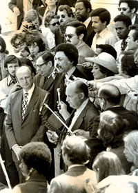 In this 1971 photograph, freshman House Members and outspoken peace advocates <a href="/member-profiles/profile.html?intID=38">Ronald Dellums</a> of California (center) and Bella Abzug of New York (in hat, at Dellums&rsquo;s left), speak to reporters about their proposal to conduct an unofficial inquiry into alleged U.S. war crimes in Vietnam. Two years later, at the insistence of House leaders who overrode Chairman F. Edward H&eacute;bert of Louisiana, Dellums earned a seat on the House Armed Services Committee, which had jurisdiction over every facet of the defense establishment.