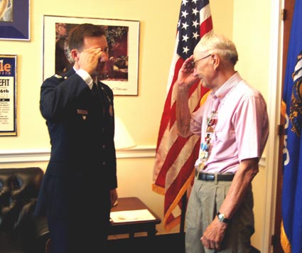 Col. Anthony Lzarski salutes Gordon Brittnacher