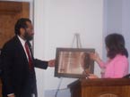 Congressman Green is presented with a token of appreciation for his work on housing issues by the National Fair Housing Alliance.