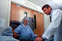 National Institutes of Health photo of doctor, nurse and patient in hospital recovery room.