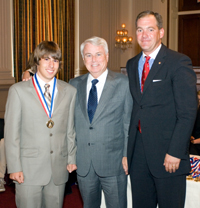 Jeff Lyon, left, is congratulated by Congressman Gallegly, center, on receiving the Congressional Gold Medal, June 21, 2006.