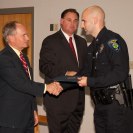 Photo: Honoring a member of the Claremont Police Department at the Law Enforcement Awards Ceremony.