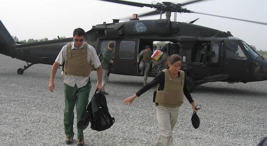 Rep. Schmidt leaving a helicopter and arriving in Iraq