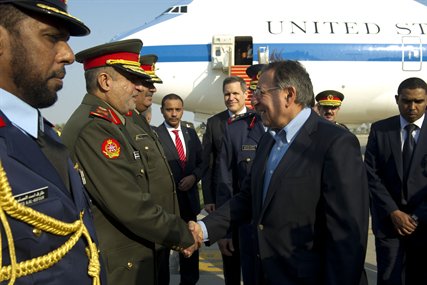 U.S. Defense Secretary Leon E. Panetta meets Kuwaiti military members upon his arrival in Kuwait City, Kuwait, Dec. 11, 2012.