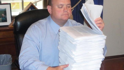 Rep. Reed looks over new regulations imposed on businesses over a 2 week period. feature image