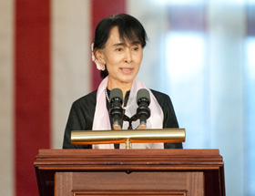 Suu Kyi at the podium