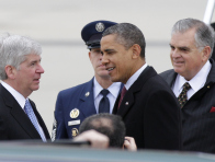 President Barack Obama was greeted by Michigan Gov. Rick Snyder hours before he criticized right-to-work legislation Snyder has helped push through the State House in the last week (Photo by Duane Burleson/AP)