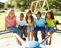 istockphoto_13200832-children-riding-on-roundabout-in-playground