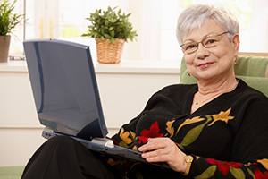 Retiree using a laptop 