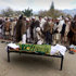 Afghan relatives and villagers prepare to offer funeral prayers over the body of Najia Sediqi, Laghman's head of the women's affairs department in Laghman, east of Kabul, Afghanistan, Monday, Dec. 10, 2012. Gunmen shot and killed the head of the women's affairs department for the eastern Laghman province, said Sarhadi Zewak, a spokesman for the provincial government. (AP Photo/Khalid Khan)