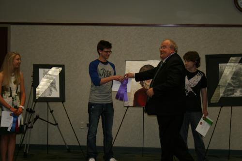 Representative Long stands with Congressional Art Competition participants 