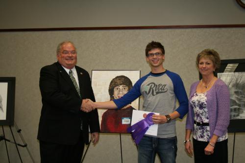 Long shakes hands with 7th District Congressional Art Competition first place winner Aaron Conway from Mt. Vernon High School 