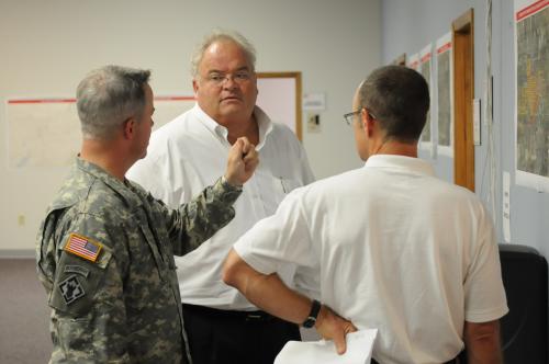Billy is briefed by Col. Daniel Patton (left) on the U.S. Army Corps of Engineers' Joplin recovery effort at the Joplin Recovery Field Office in Joplin, Mo.