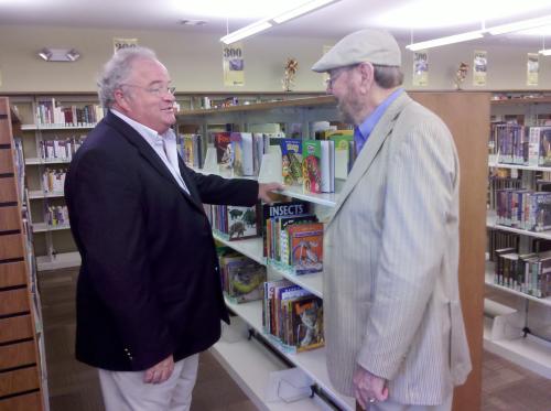 Rep Long and Max Croxdale inside the library after the ribbon cutting.