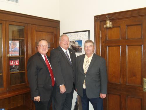 Congressman Long with Dairy Association. Larry Purdom of Purdy on the right and Dave Drennan on the left.
