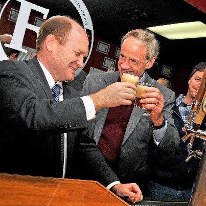 Photo: Delaware State News/Dave Chambers
Sens. Chris Coons, left and Tom Carper toasted the new ownership of Fordham Brewery in Dover during a scheduled tour in January