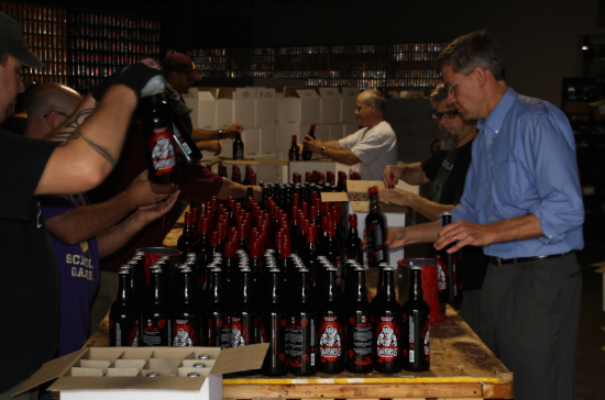 Rep. Paulsen visits local small business Surley Brewery and helps package their new batch of seasonal brews