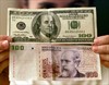 U.S. and Argentine banknotes, file. REUTERS Enrique Marcarian