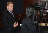 Chairman Smith talks to a reporter after a hearing on the Balkans