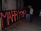 Cody Daniel made this sign out of Christmas lights to propose to Jess Cadieux, Wednesday, Dec. 5, 2012. Daniel hooked the sign up to a dock at the Burlington waterfront. (Courtesy photo) 