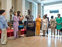 Speaker of the House Nancy Pelosi, First Lady Michelle Obama, and Secretary of State Hillary Rodham Clinton joined in celebrating the unveiling of the bust of abolitionist Sojourner Truth.