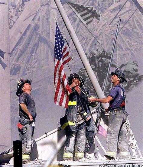 Ground Zero as NY firefighters pull from the rubble and raise the American flag