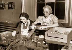 Two women work at a clip spring and body assembly line for .30 caliber cartridges at an arsenal in Pennsylvania during World War II. Women filled numerous jobs on the wartime home front that were essential to equipping troops deployed overseas.