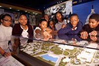 Caption: Students explore a scale model of the Capitol campus in the Capitol Visitor Center's Exhibition Hall 