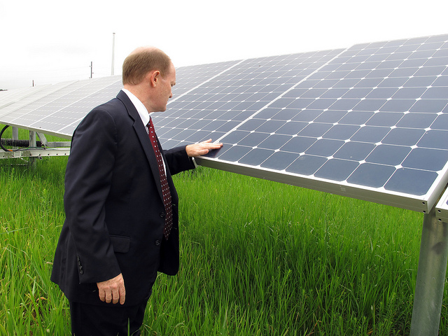 Senator Coons checks out a solar panel in Dover, Delaware