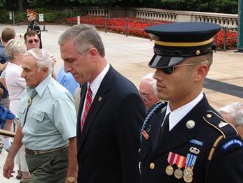 A member of the Old Guard, which watches over the Tomb of the Unknowns, escorts Congressman Murphy and the veterans from the wreath laying ceremony.