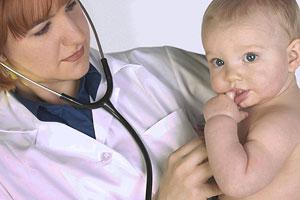 Health professional examining a young patient.