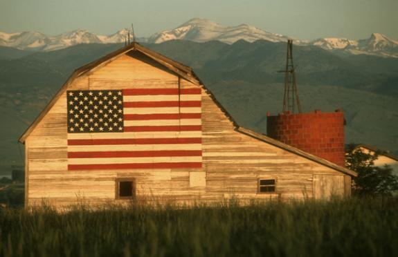 barn with flag painted on side