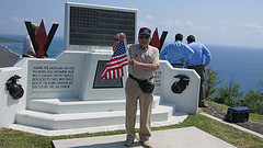 David Greene of Waterloo, Iowa, on the summit of Mount Suribachi.  Greene served in the Marine Corps during the Battle of Iwo Jima.Greene will share this flag with schoolchildren when he speaks about the war.