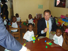 Congressman Smith handing out colored pencils 
